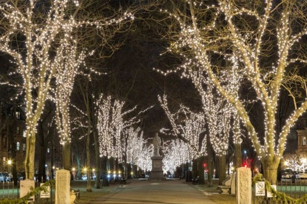 Warm white Christmas lights on a two-story home